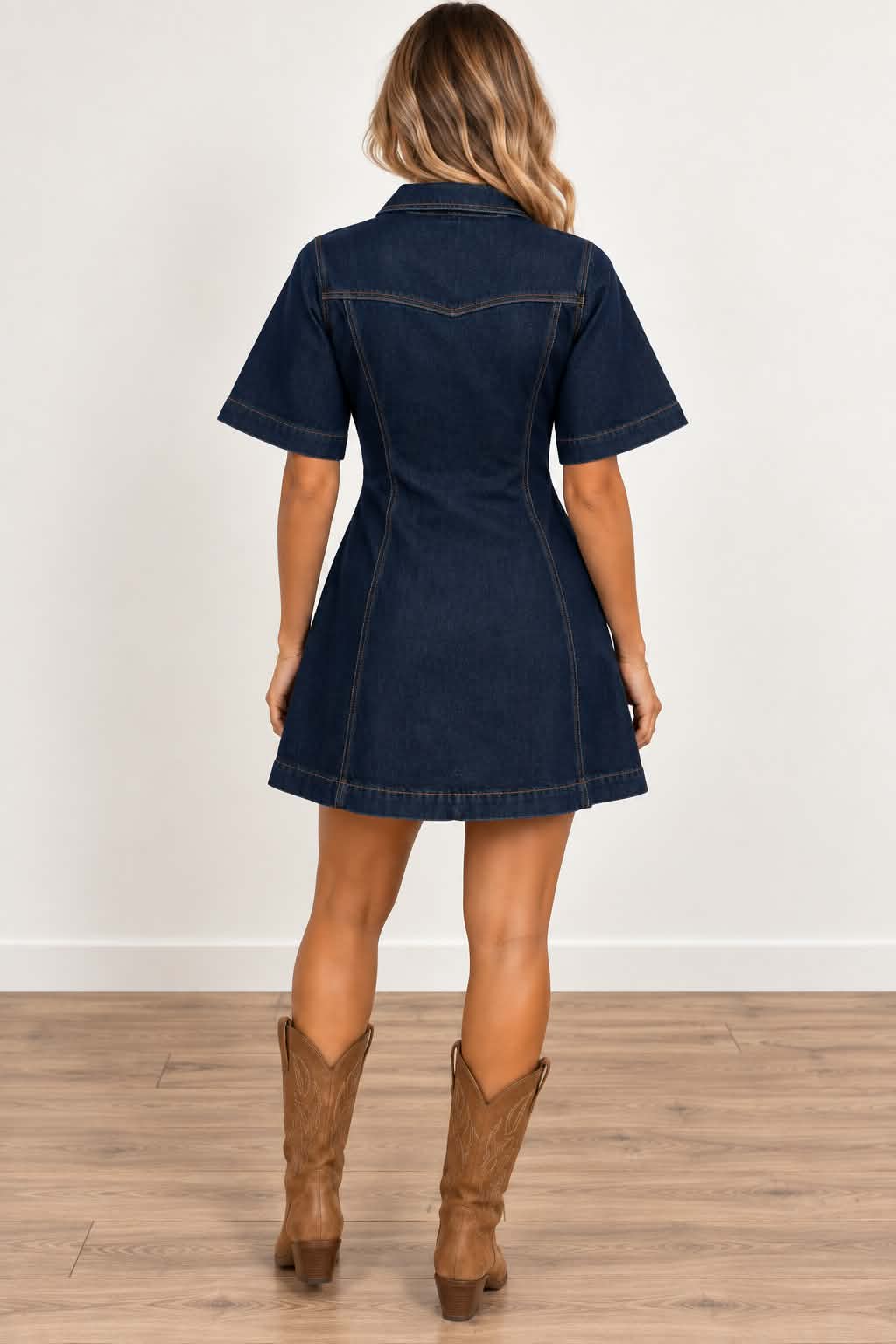 Back view of Cheyenne dark denim western dress showing tan contrast stitching and flattering flared silhouette