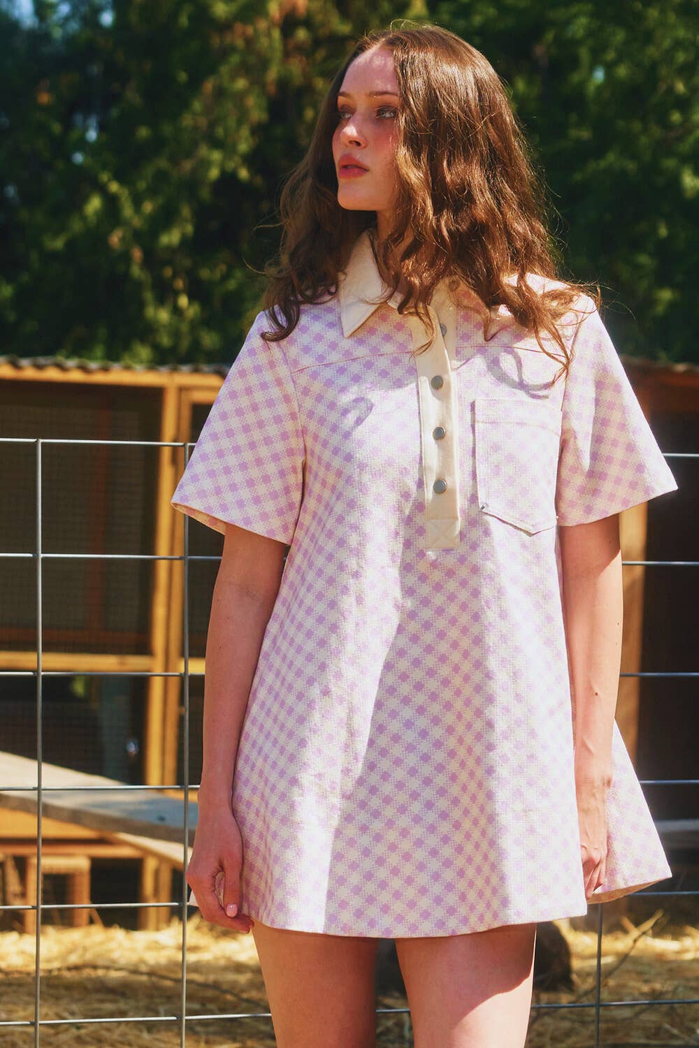 women wearing checkered print mini dress, women wearing 1960's inspired checkered dress, women wearing a mini dress with western inspired accessories