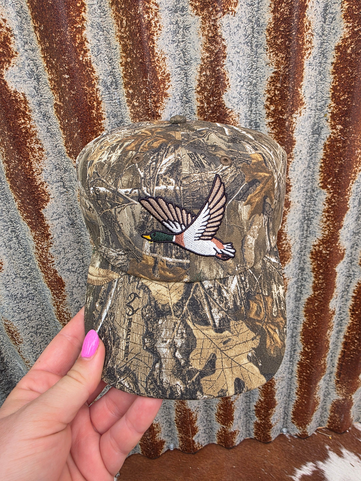 Camo country cap featuring detailed duck embroidery