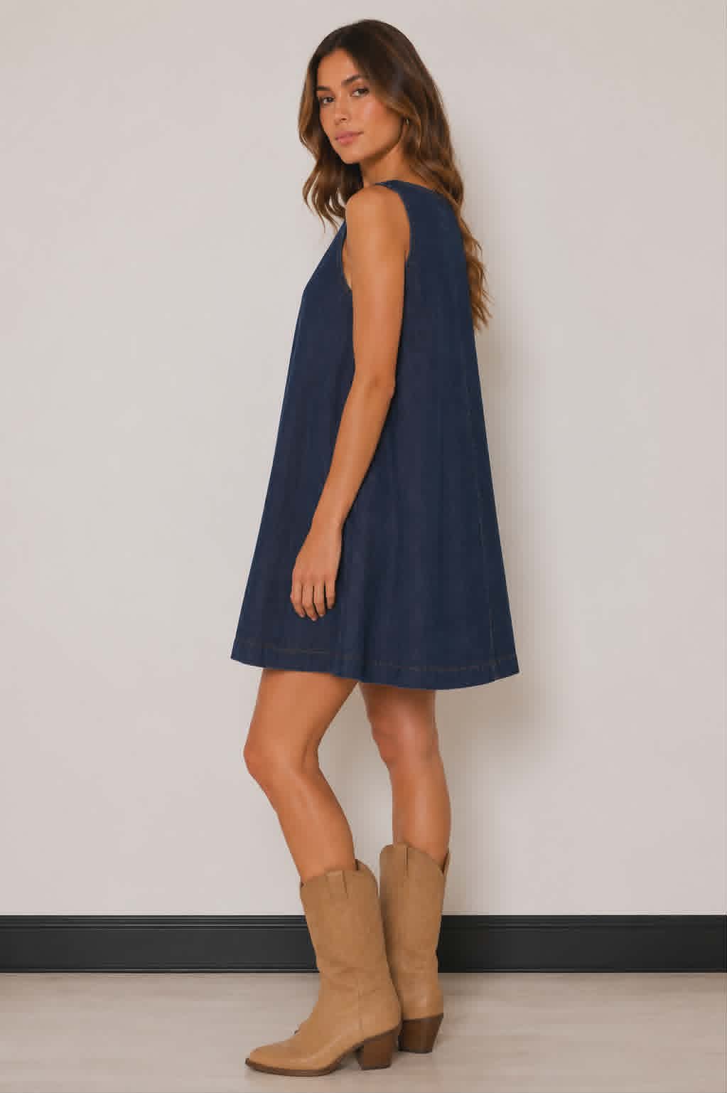 Western style denim smock dress in a dark indigo wash with an easy throw-on fit, subtle seam detailing and flowy skirt. Perfect for layering with boots and statement jewellery