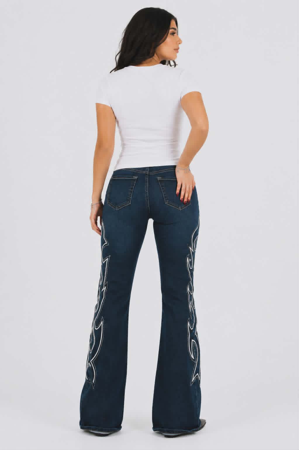 Dark blue western bootcut flare jeans with statement white stitching and comfortable stretch fit.