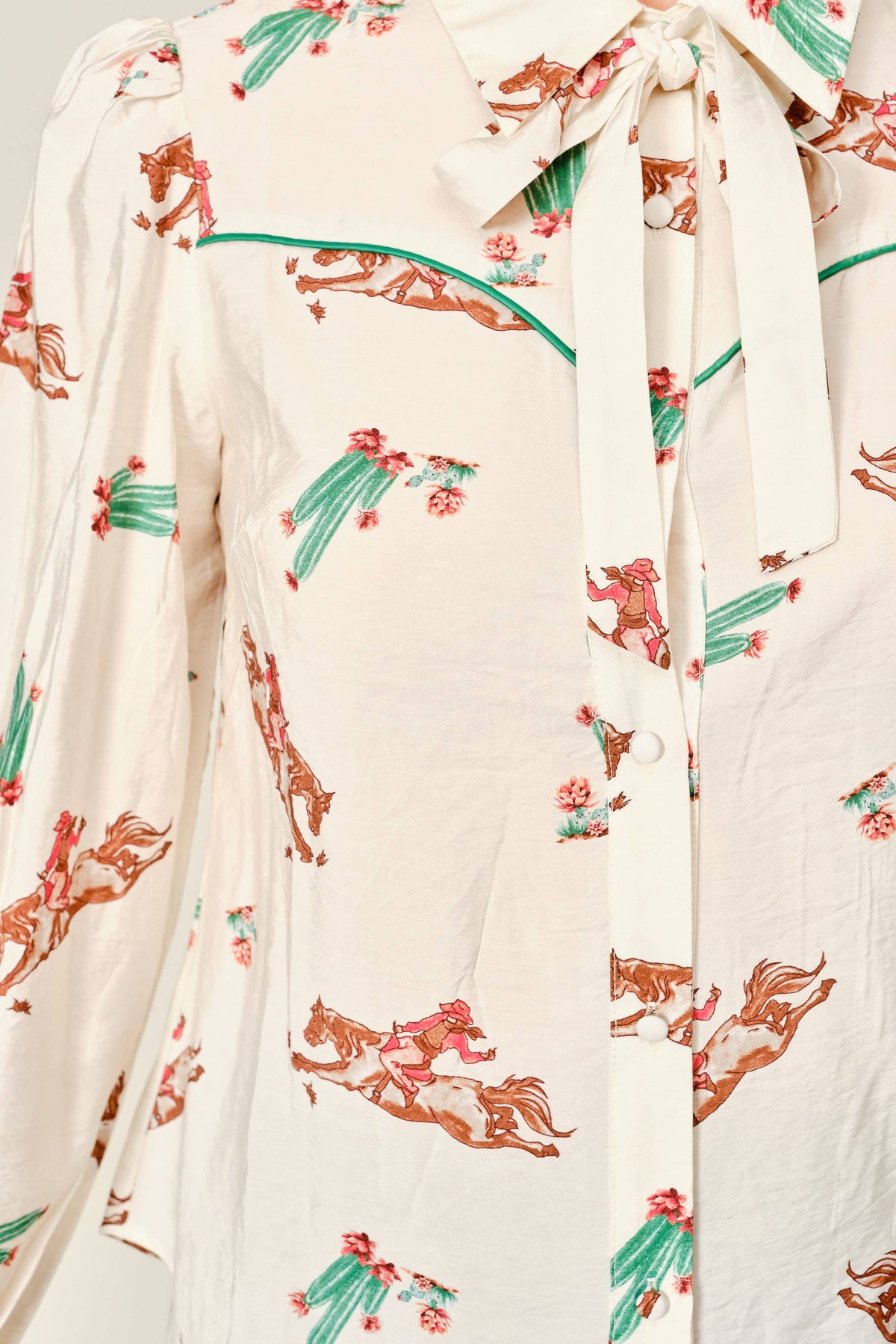 Women's western tie neck blouse with cowboy and cactus print