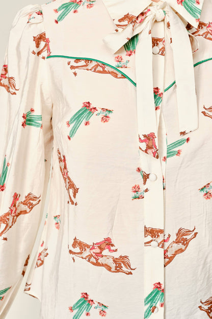 Women's western tie neck blouse with cowboy and cactus print