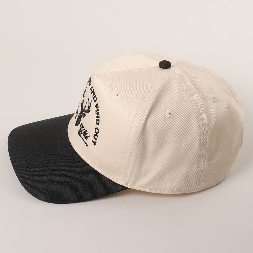 Cream 5 panel cap with black brim and bold deer head embroidery