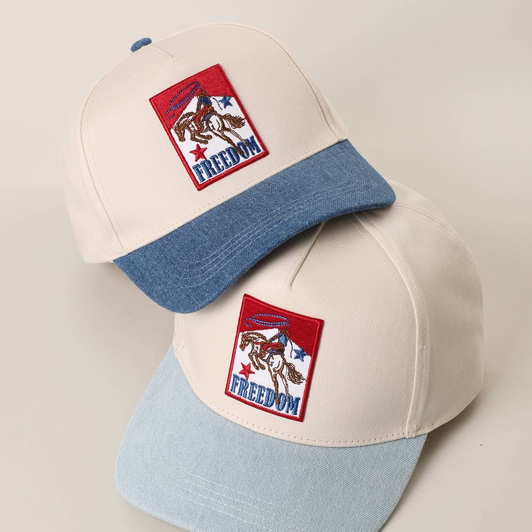 Cream western trucker cap with blue brim and Freedom cowboy embroidered patch