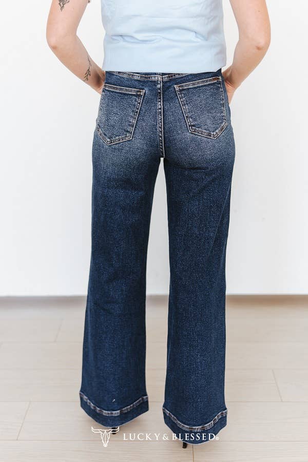 Statement cowgirl jeans with bold white western embroidery, perfect for rodeos, country concerts and everyday western wear
