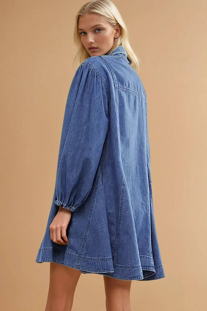Western-inspired denim mini dress featuring a relaxed fit, collar and chest pocket