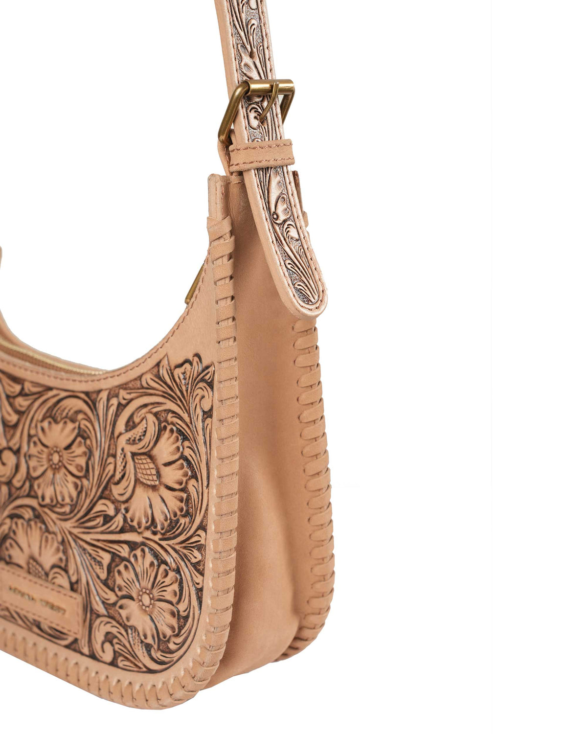 Western cowgirl shoulder bag with tooled leather strap