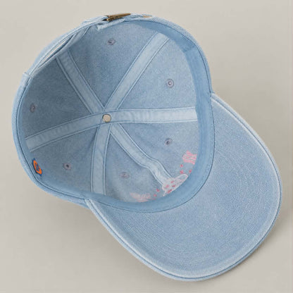 Women's light wash denim cap with cowgirl inspired embroidery and curved brim