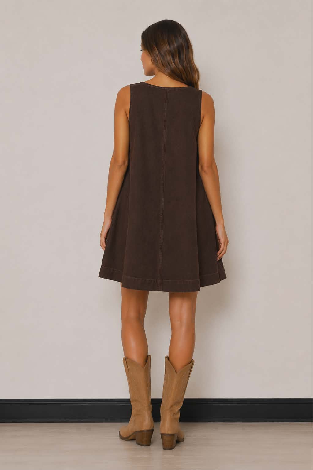 Relaxed fit brown western dress with a flattering flowy shape, subtle seam detailing and sleeveless design. The perfect throw-on piece for rodeos, festivals and casual country outfits