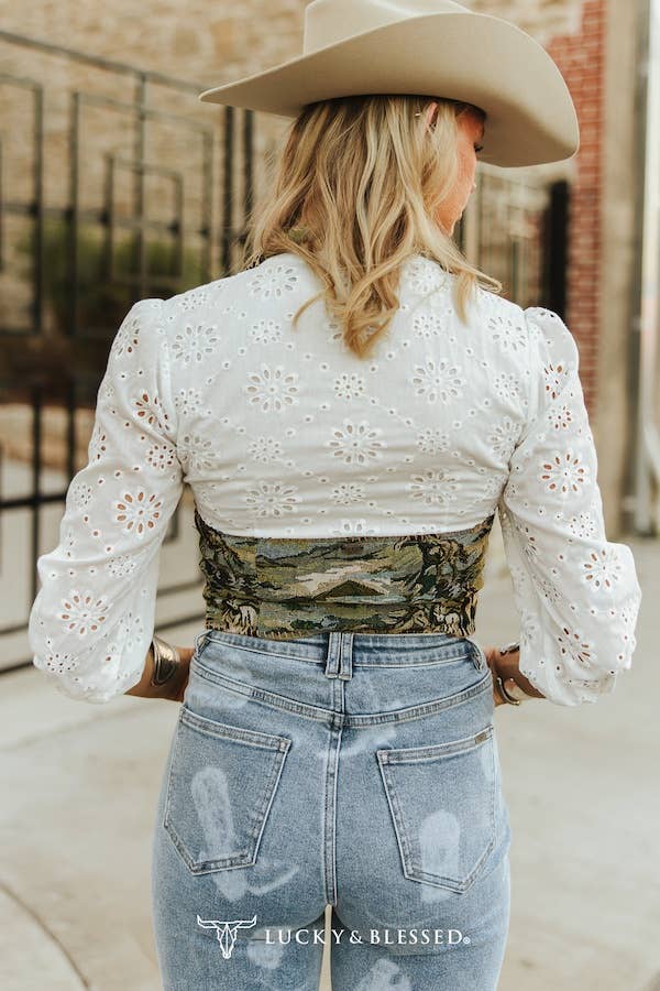 western cropped tapestry vest styled with denim and statement buckle belt