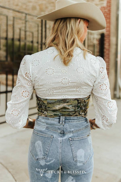 western cropped tapestry vest styled with denim and statement buckle belt