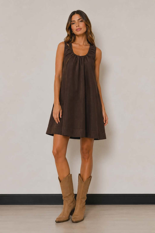 Chocolate brown sleeveless swing dress with relaxed oversized fit, soft gathered neckline and flowy A-line silhouette. Styed with cowboy boots for ultimate western inspired look