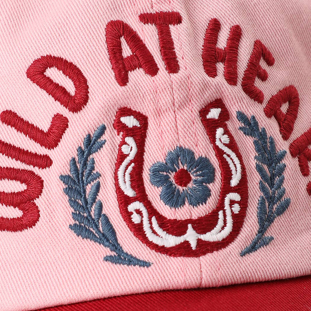Country trucker style cap in pink with red brim and western inspired embroidery