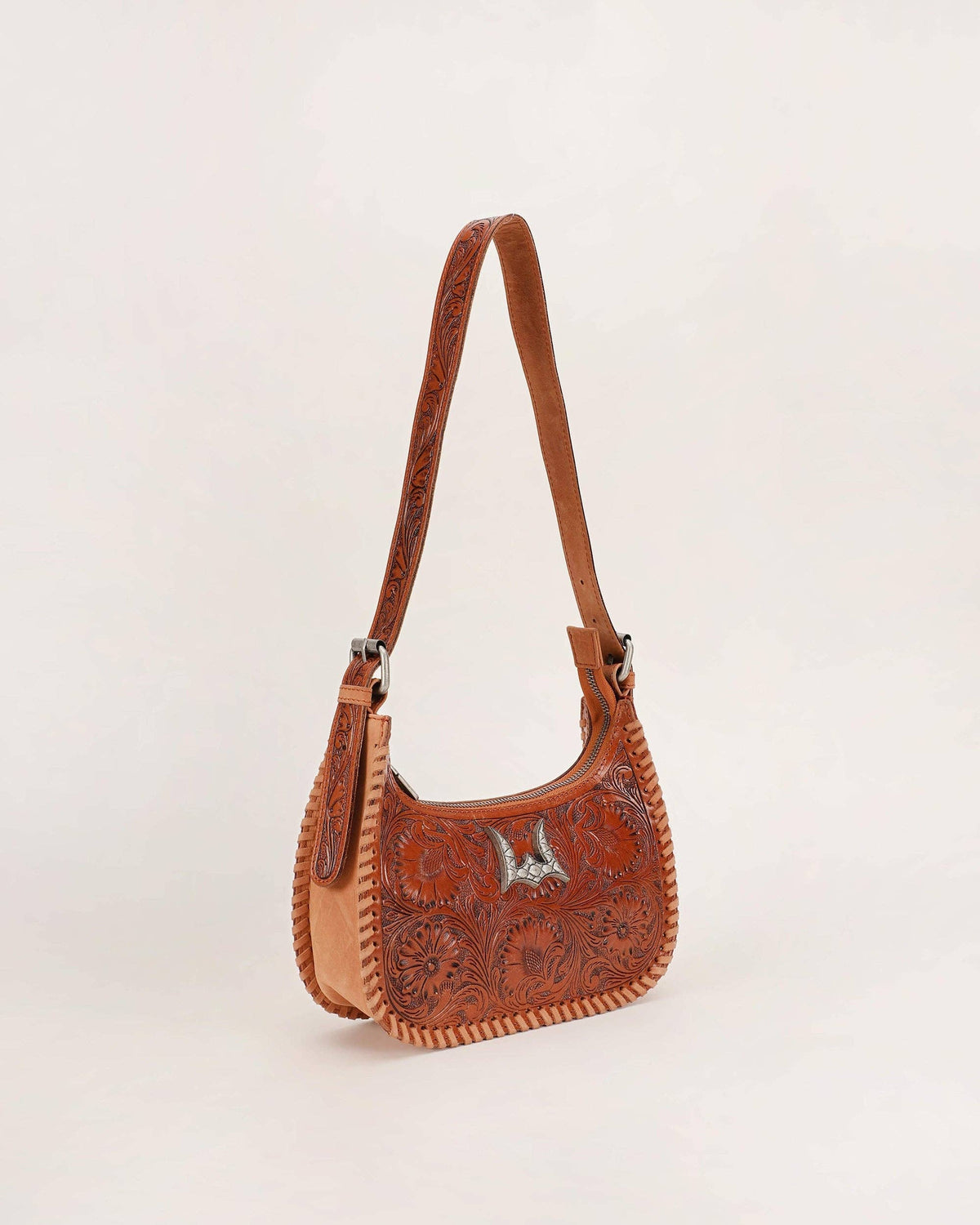 Dannia Medium Purse styled with black clothing showing tan leather western shoulder bag