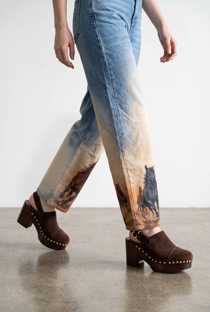 Blue denim barrel jeans with horse graphics on legs