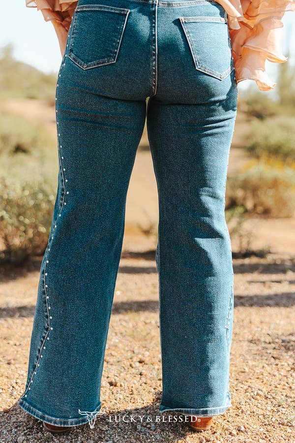 Western inspired bootcut jeans with rhinestone stud accents and stretch denim