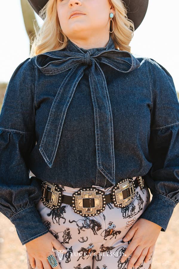 soft structured denim blouse featuring statement balloon sleeves and tie neckline