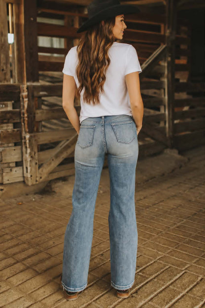 High-rise western jeans in a light wash denim with a relaxed flare leg and comfortable fit perfect for country western events
