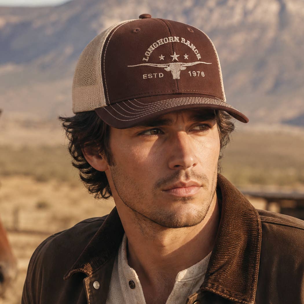 Western trucker hat featuring embroidered longhorn design and adjustable snapback