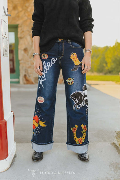 Statement western denim jeans styled with a black knit sweater and cowboy botts for a country inspired outfit