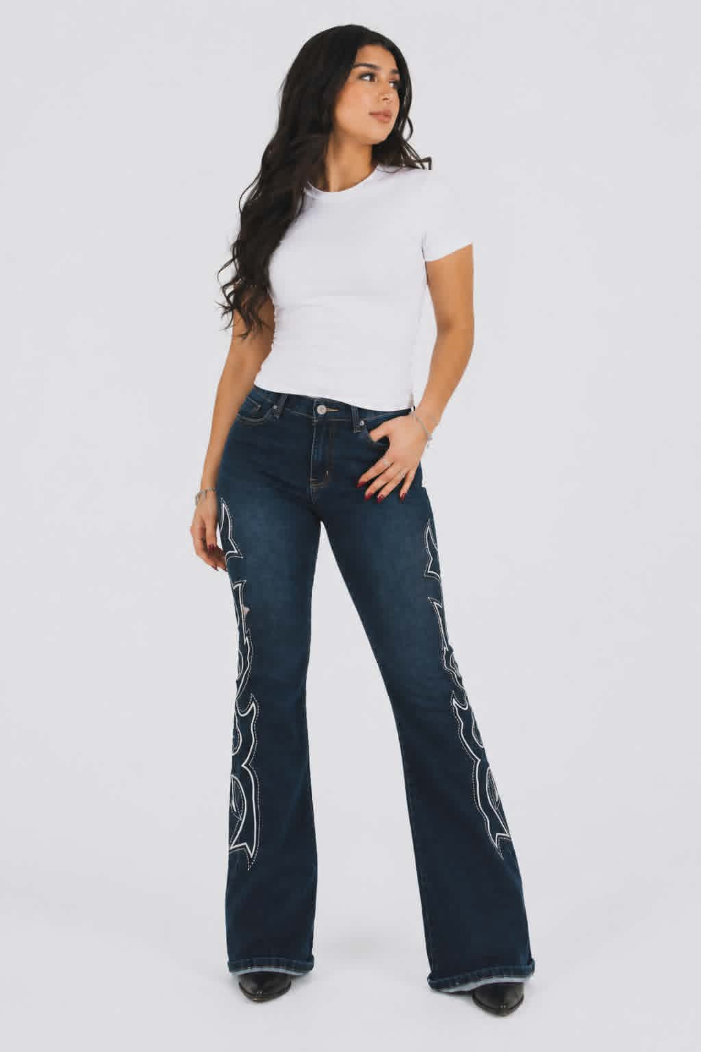 Women's western flare jeans featuring bold embroidered side panels in dark stretch denim