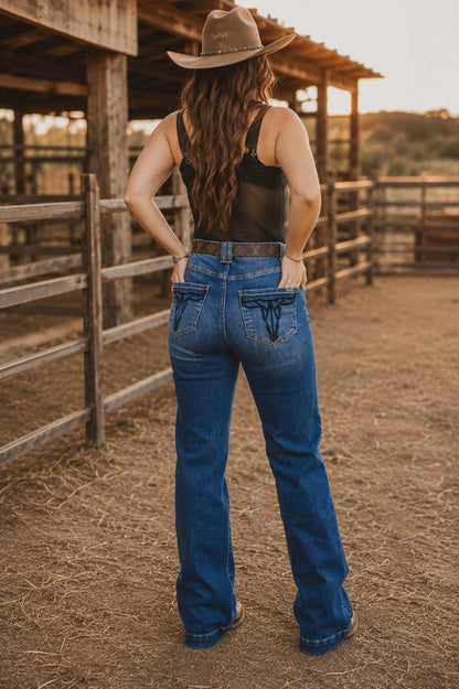 Western bootcut style jeans with embroidered pockets, stretch denim and classic dark wash finish