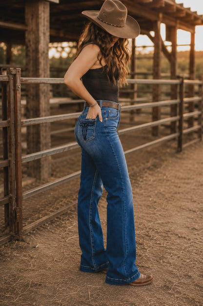 Dark wash cowgirl jeans featuring signature western detailing and comfortable everyday wear
