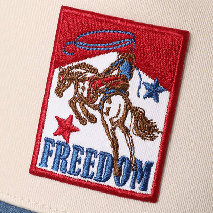 Western snapback cap with cowboy, horse and lasso patch in red, white and blue.
