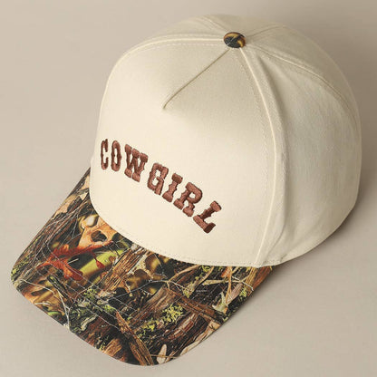 Western snapback cap featuring embroidered Cowgirl text and camouflage brim