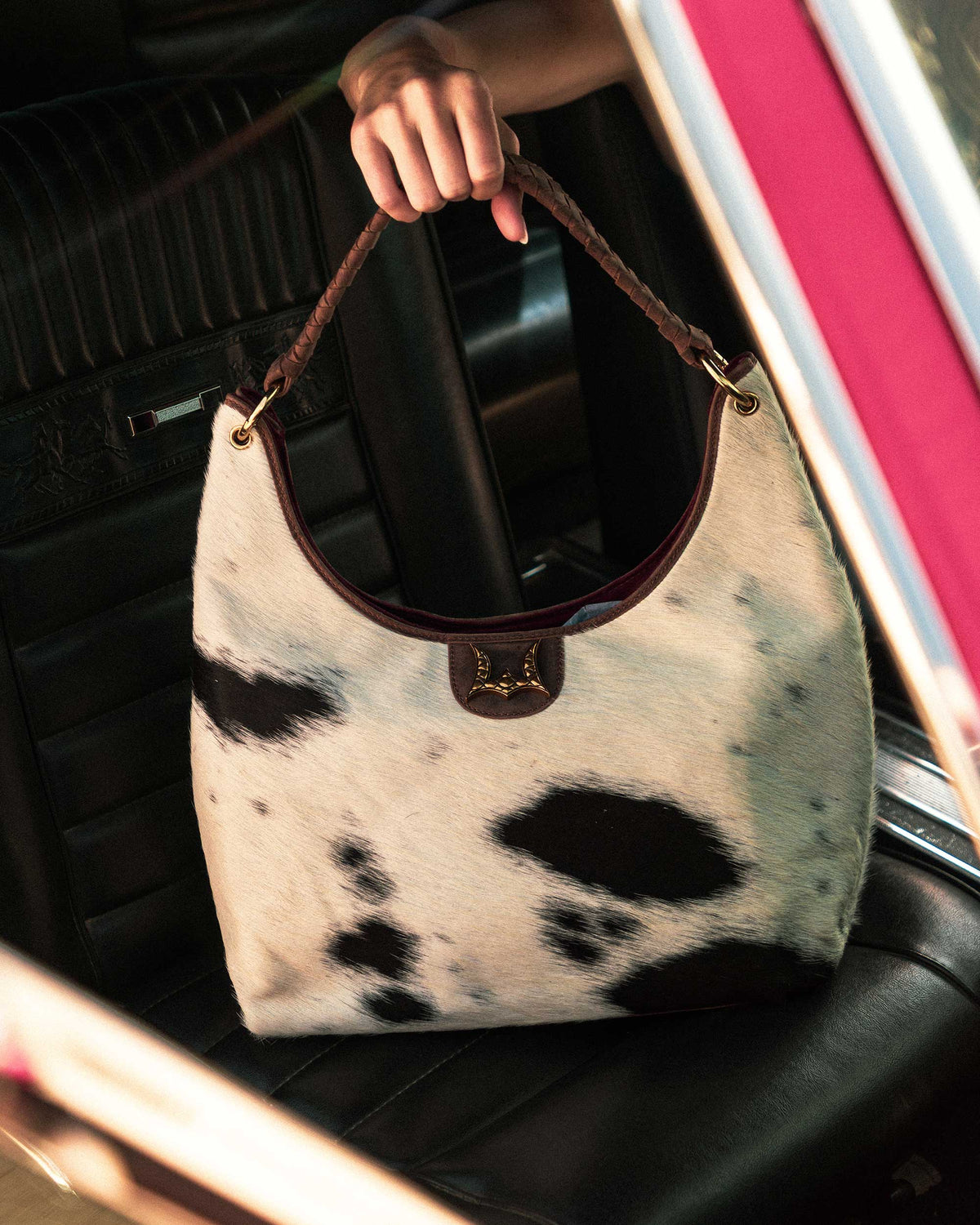 Natural black and white hair on cowhide shoulder bag with brown leather