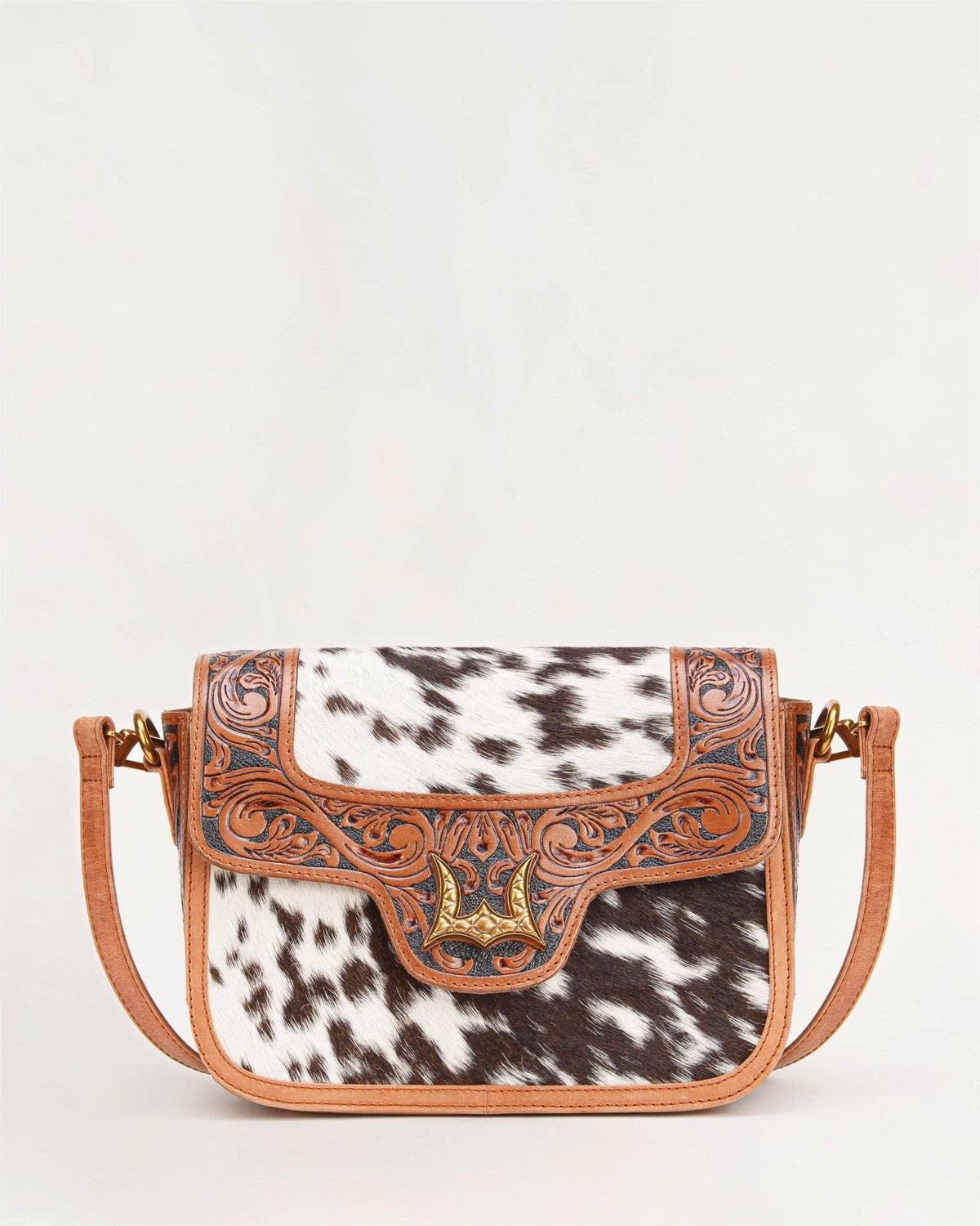 Desert Desire medium western shoulder bag featuring genuine calfskin hair on cowhide and decorative gold tone hardware
