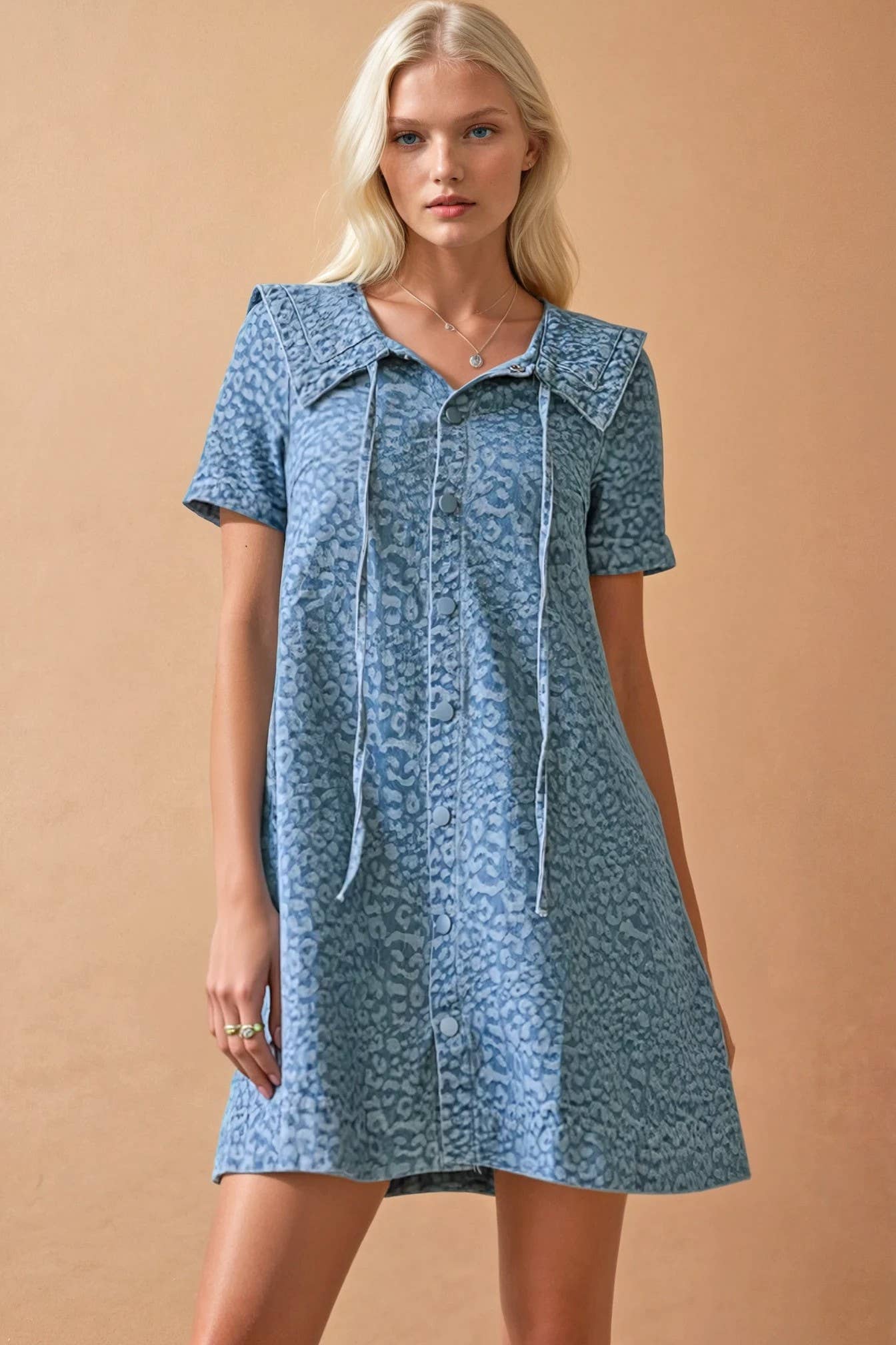 Women's lightweight blue mini dress with vintage inspired print and feminine silhouette