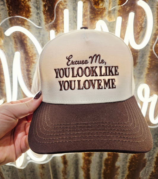Cream and chocolate brown western trucker cap featuring embroidered "Excuse Me, You Look Like You Love Me" slogan with a curved brim