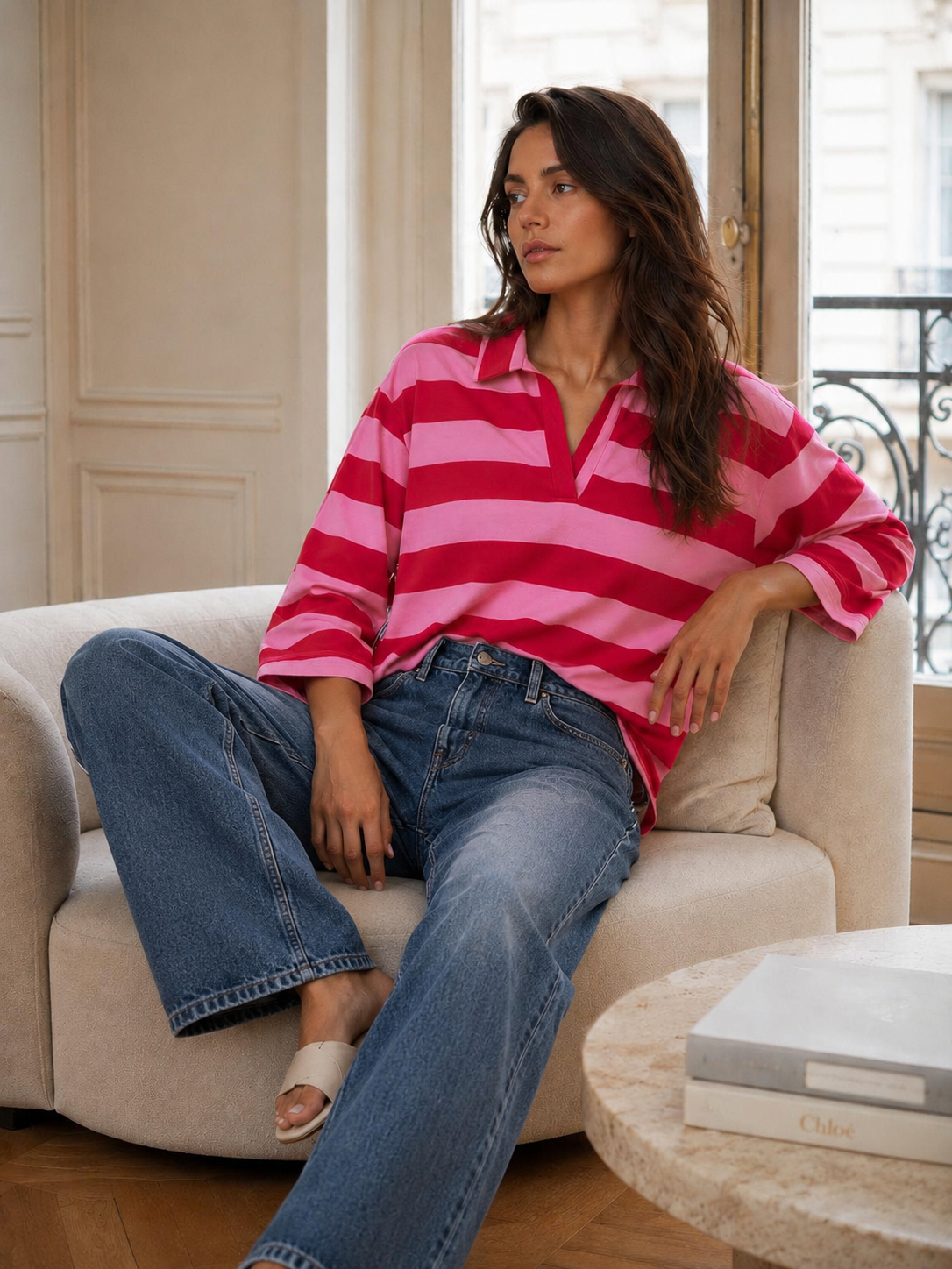 Bright pink and red striped cotton rugby top for women styled with relaxed everyday denim